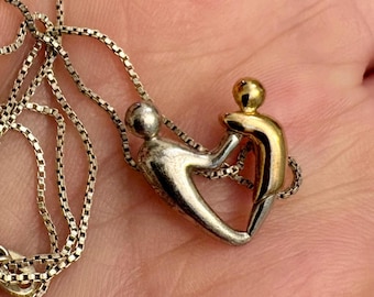 Mother and child pendant / silver and gold