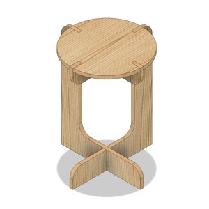 Peut inclure: Un tabouret en bois avec un dessus rond et une base en forme de croix. Le tabouret est en bois brun clair et a un design simple et moderne.