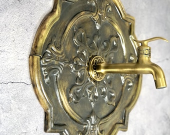 Decorative golden copper ceramic tiles for wall faucet . Antique vintage look, wall decor.