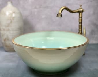 Ceramic vessel sink, gold rimed,  Green and white table  top wash basin.