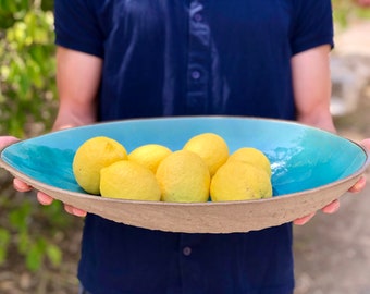 Extra large, Turquoise Elliptical fruit bowl.