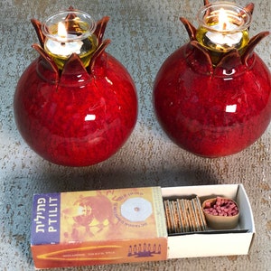 Ceramic pomegranate oil lamp.