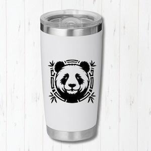 May include: A white travel tumbler with a silver lid and base. The tumbler features a black and white panda bear design in a square frame with bamboo leaves. The panda's face is centered on the tumbler.