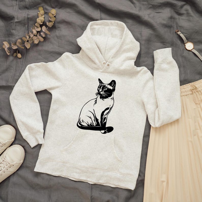 May include: A white hooded sweatshirt with a black silhouette of a cat sitting on the front.