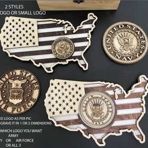 May include: Wooden United States map with a flag design and military emblems. The image shows options for Army, Navy, and Air Force logos, with text indicating 2 styles: large or small logo. The map is made of wood.