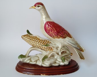 A porcelain figurine, a bird on a head of corn. Portugal