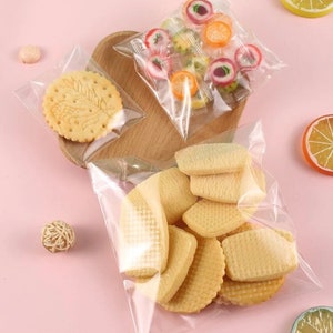 Klare transparente selbstklebende Verpackungsbeutel aus Kunststoff (Xs / S / M / L) Packung mit 10, 25, 50 oder 100 Beuteln