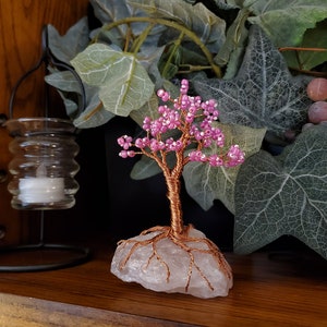 Pink and white beads on a rose quartz base