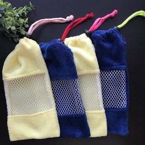 May include: Four colorful drawstring bags with mesh panels. The bags are made of a soft, plush material and are perfect for storing small items.