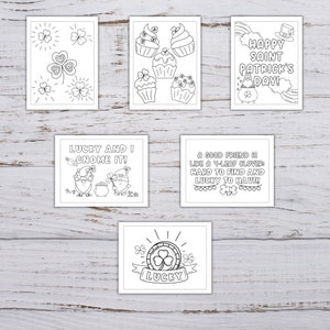 May include: A set of six printable coloring pages featuring St. Patrick's Day themes. The pages include images of shamrocks, cupcakes, gnomes, and a pot of gold. The text on the pages includes "Happy Saint Patrick's Day!" and "Lucky and I Gnome It!"