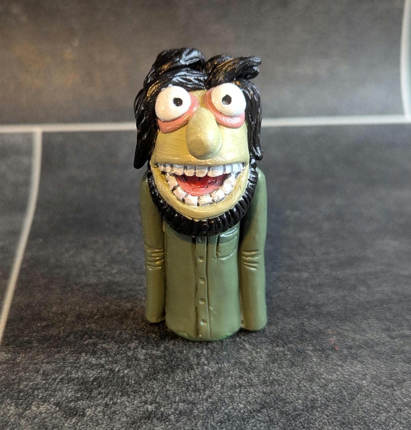 The Muppet Show - Figurine Articulée Palisades - Floyd Pepper (veste bleue