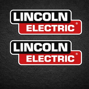 May include: Two Lincoln Electric logo stickers. Each sticker features the words "LINCOLN ELECTRIC" in white text on a black and red background. The stickers are on a textured black surface.