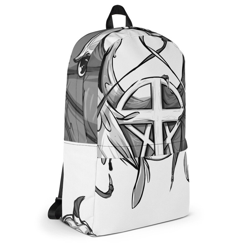May include: A black and white backpack with a graphic design featuring a stylised circle with a cross inside. The design is surrounded by abstract shapes and lines.