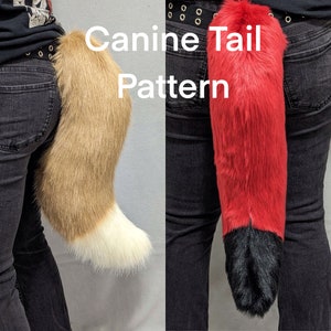 May include: Two furry canine tails, one brown and white, the other red and black, are attached to the back of a person wearing jeans. The text "Canine Tail Pattern" is written in white letters on a black background.