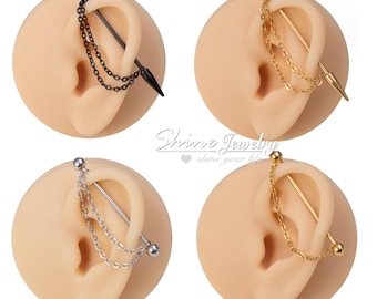 May include: Four industrial barbell earrings in black, gold, silver, and gold. Each earring features a chain and spike design. The earrings are displayed on a tan ear model. The text "Shine Jewelry shine your life" is in the centre.