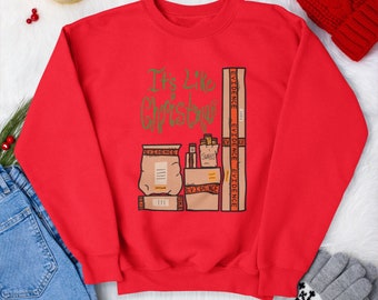 May include: Red Christmas sweatshirt with a graphic of a stack of boxes labeled "Evidence" and the text "It's Like Christmas" in gold lettering.