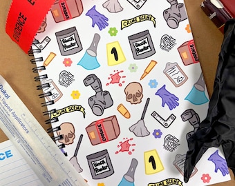 May include: A spiral-bound notebook with a white cover featuring a repeating pattern of crime scene-related illustrations. The design includes a camera, skull, fingerprint, and the words "CRIME SCENE". A red "EVIDENCE" tape is draped across the top.