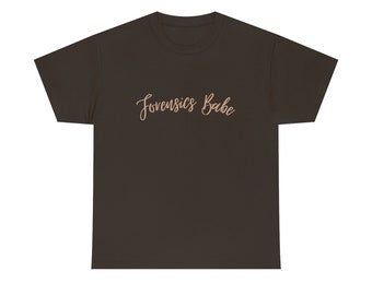 May include: A dark brown t-shirt with the text "Forensics Babe" printed in a light pink color.