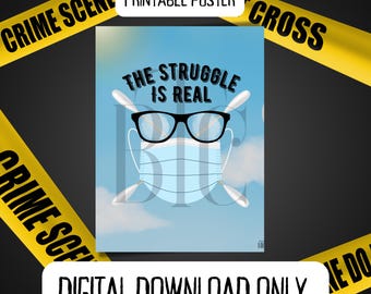 May include: A printable poster with a blue background and white clouds. The poster features a cartoon face wearing glasses and a blue face mask. The text "The Struggle Is Real" is written in black above the face.