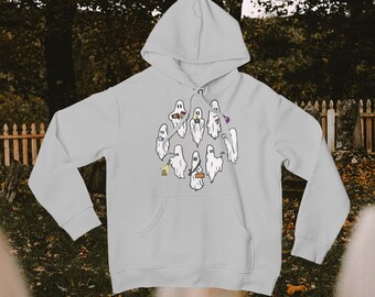 May include: A light gray hoodie with a graphic of a group of ghosts wearing different costumes and holding various objects. The ghosts are white and have black eyes and mouths.