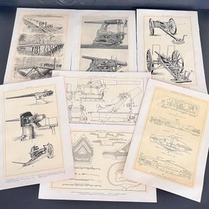 May include: A collection of vintage black and white prints featuring detailed illustrations of artillery and military engineering. The prints showcase various cannons, diagrams, and schematics, offering a glimpse into historical military technology.