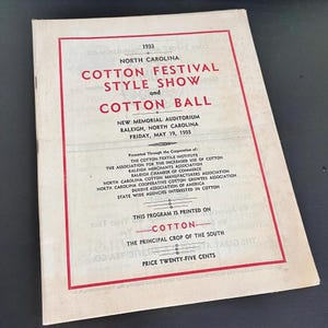 May include: A vintage program from the 1933 North Carolina Cotton Festival Style Show and Cotton Ball. The cover features red text and a red border, with the event details and participating organizations listed. The price is twenty-five cents.