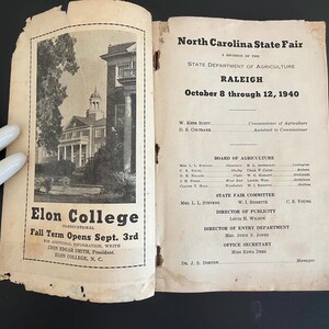 May include: Open vintage pamphlet for the North Carolina State Fair in Raleigh, October 8-12, 1940. The left page features a black and white image of Elon College with text: "Fall Term Opens Sept. 3rd."