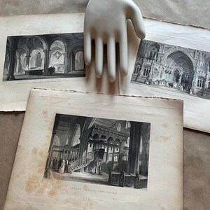 May include: Three black and white antique prints of the interior of a church. The prints are framed and have a white mat. The prints are titled "The Eastern Pillar End of York Cathedral", "Entrance to the Choir of Salisbury", and "Preston Church, Lancashire".