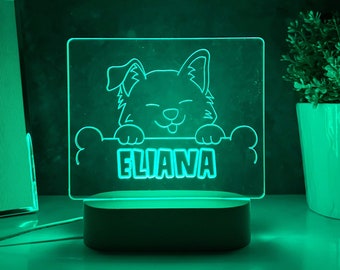 May include: A green LED night light with a cartoon dog peeking over a bone-shaped sign that says "ELIANA".