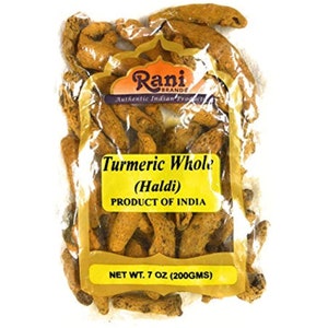 May include: A clear plastic bag filled with whole turmeric root pieces. The bag has a yellow label with the text "Rani Brands Authentic Indian Products Turmeric Whole (Haldi) PRODUCT OF INDIA NET WT. 7 OZ (200GMS)"