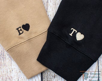 sweatshirt with initial on sleeve
