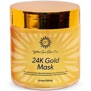 Può includere: Un barattolo cilindrico di 24K Gold Mask di Yellow Sun Skin Care con un coperchio dorato lucido. L'etichetta presenta una grafica a raggiera, il testo 24K Gold Mask e il peso netto di 250 g stampati chiaramente sulla parte anteriore.