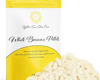 May include: A white bag with a yellow sun graphic and the text "Yellow Sun Skin Care" and "White Beeswax Pellets". The bag contains white beeswax pellets. The text on the bag reads "Beeswax contains high levels of Minerals and Vitamins that helps condition the skin and lock in moisture."