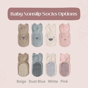 May include: Baby nonslip socks in beige, dust blue, white, and pink with grippy bottoms. Each sock features a cute animal face.