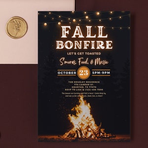 May include: A black invitation card with the words "FALL BONFIRE" in a glowing font, with the text "Let's Get Toasted" and "S'mores, Food, & Music". The date is October 23, 5PM-9PM. A bonfire illustration is at the bottom.