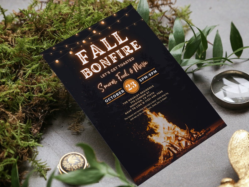 May include: A black invitation card with the words "FALL BONFIRE" in a glowing orange font, along with details for an event including the date, time, and location. The card features a bonfire illustration at the bottom and string lights at the top.