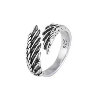 May include: Silver ring with a wing design. The ring is open on one side and has the number 925 stamped on the inside.