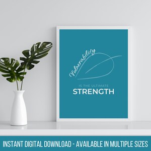 May include: A teal blue printable wall art print with white text that reads "Vulnerability is the ultimate strength". The text is written in a cursive font and is accompanied by a white line drawing of a curved line.