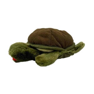May include: A plush turtle toy with a brown shell and green body. The turtle has a red mouth and is lying on a white surface. The toy is made of soft, fuzzy material.