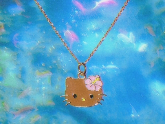 Gold plated Hawaiian tan hello kitty | y2k accessories , coconut girl summer