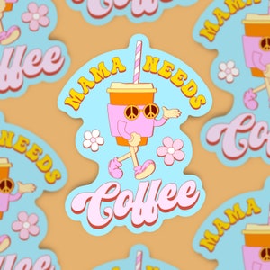 May include: A blue and pink sticker with a cartoon coffee cup wearing sunglasses and walking. The text on the sticker says "Mama Needs Coffee".