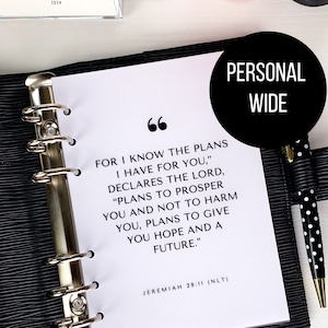 May include: A white page with black text from the Bible verse Jeremiah 29:11, "For I know the plans I have for you," declares the Lord, "plans to prosper you and not to harm you, plans to give you hope and a future." The text is in a black binder with a black and white polka dot pen.