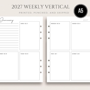 May include: A white 2027 weekly vertical planner with the text "2027 WEEKLY VERTICAL" and "PRINTED, PUNCHED, AND SHIPPED". The planner has a black A5 circle and the month of January is written in cursive.