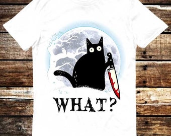 May include: White t-shirt with a black cat holding a bloody knife in front of a full moon. The text "WHAT?" is printed below the cat.