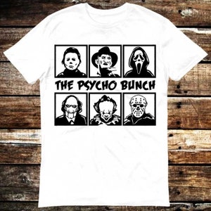 May include: White t-shirt featuring a black and white graphic of six horror movie characters in individual squares, with the text "THE PSYCHO BUNCH" below. The shirt is made of a soft, comfortable material.