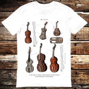 May include: A white t-shirt with a graphic print of different types of string instruments, including a violin, cello, and viola. The text "MUSIC" is printed at the top of the design. The text below the instruments reads "1. The Violin 2.3. Rebees 4.The Cronth 5. The Viol d'Amore 6. The Violoncello 7. Viol di Gamba."