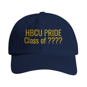 May include: A navy blue baseball cap with the embroidered text "HBCU PRIDE Class of ????" in gold. The cap has a curved brim and a button on top. This hat is a great way to show your HBCU pride.