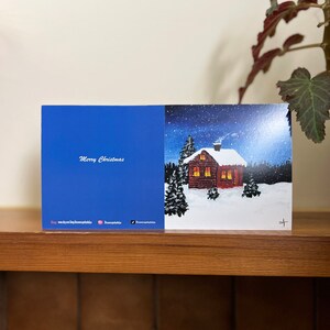 Carte d'art de cabane enneigée, peinture sur neige, carte de voeux de paysage enneigé, paysage de nuit d'hiver, carte de Noël, carte d'art de neige, art de cabane de neige