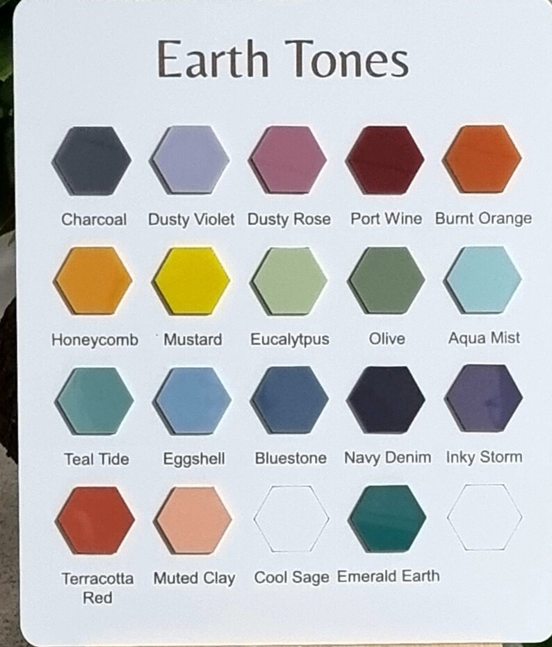 Pode incluir: Uma paleta de cores intitulada "Earth Tones" com uma variedade de amostras de cores hexagonais. As cores incluem Charcoal, Dusty Violet, Dusty Rose, Port Wine, Burnt Orange, Honeycomb, Mustard, Eucalyptus, Olive, Aqua Mist, Teal Tide, Eggshell, Bluestone, Navy Denim, Inky Storm, Terracotta Red, Muted Clay, Cool Sage e Emerald Earth.