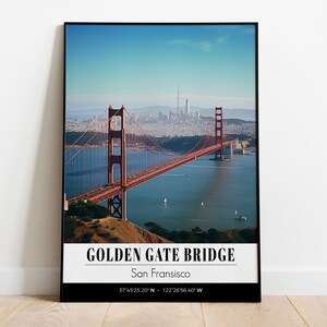 May include: A framed photograph of the Golden Gate Bridge in San Francisco, California. The bridge is red and spans a body of water with the city skyline in the background. The text "Golden Gate Bridge" and "San Francisco" is printed below the image, along with the coordinates "37.4525.20' N - 122.2656.40' W".